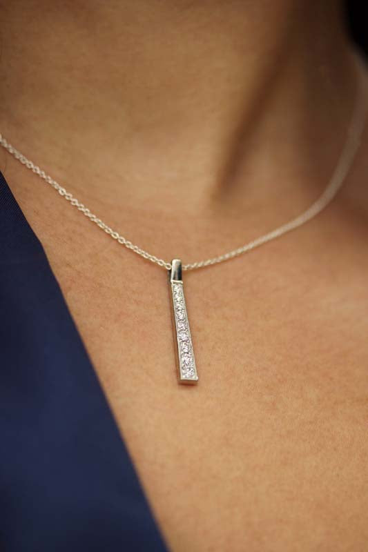 Nine-Stone 0.45 Carat Diamond Drop Platinum Bar Pendant