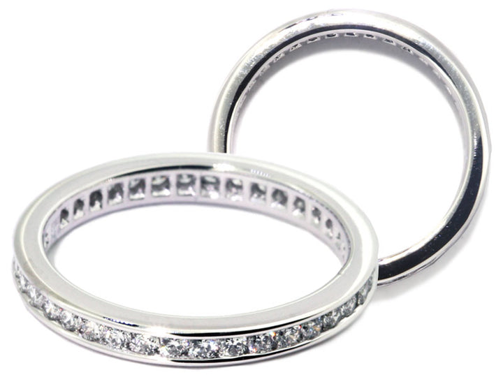 Platinum channel set engraved eternity band