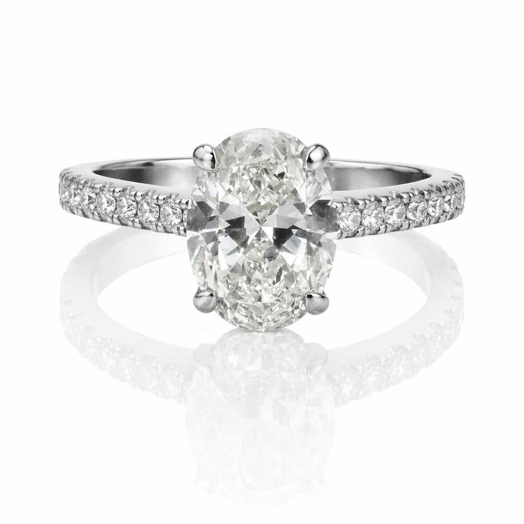 Oval Diamond Platinum Engagement Ring with Hidden Halo & Emerald