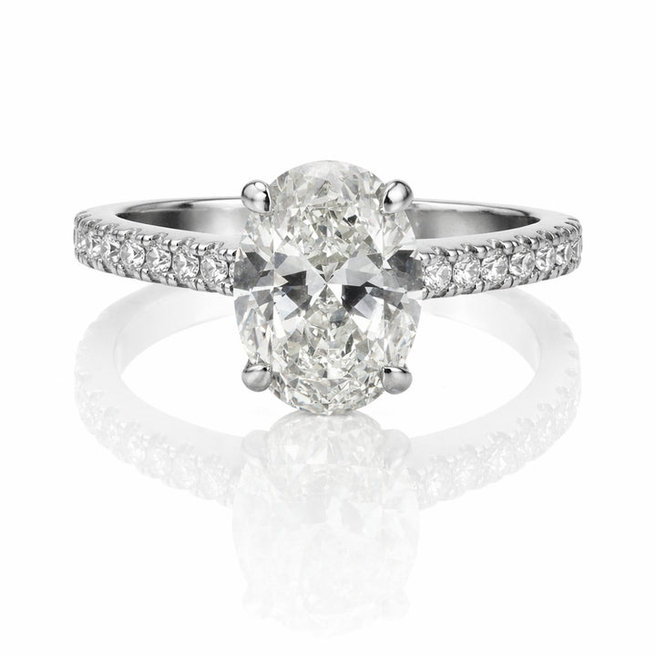 Oval Diamond Platinum Engagement Ring with Hidden Halo & Emerald