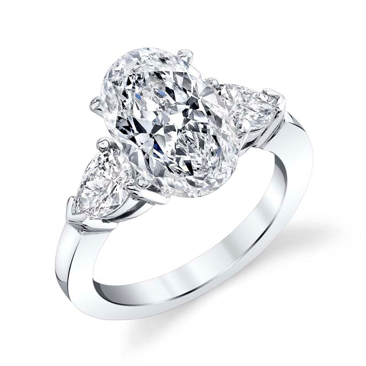 Classic three stone pear shaped platinum diamond mounting