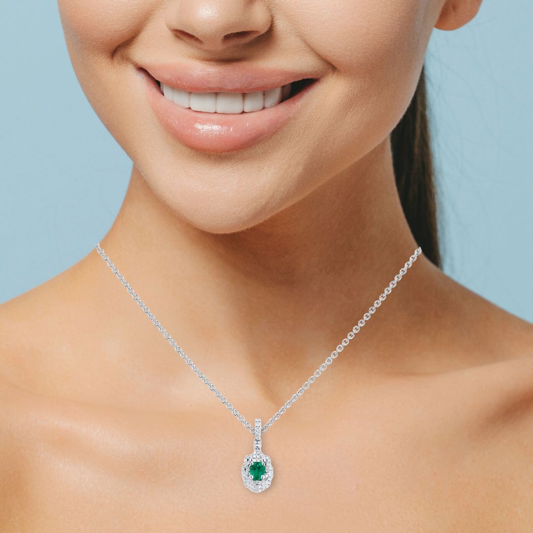 .56ct Oval Emerald .10ct Diamond Halo 18KW Pendant | Washington Diamond