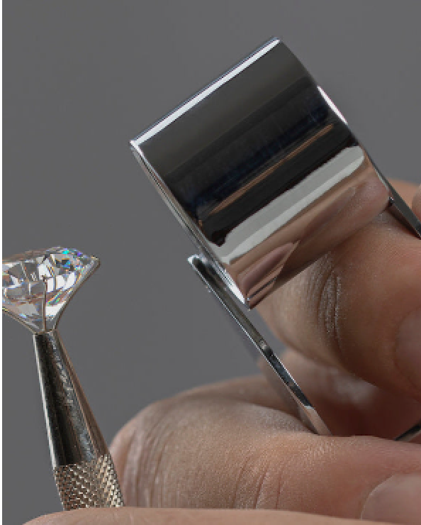 A loose diamond held in tweezers for close examination