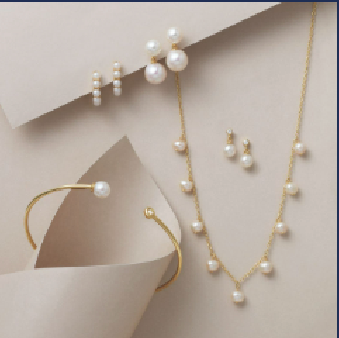 An heirloom pearl necklace and earrings brought in as the starting point for a redesign