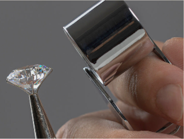 A diamond held in tweezers and examined under a loupe